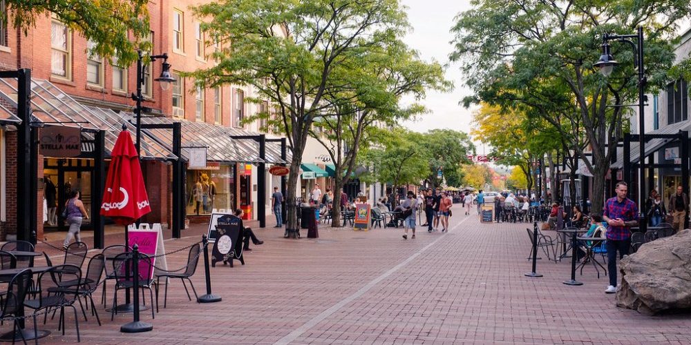Church Street in Burlington, Vermont on a summer day - cobblestone pedestrian mall with businesses, customers and trees