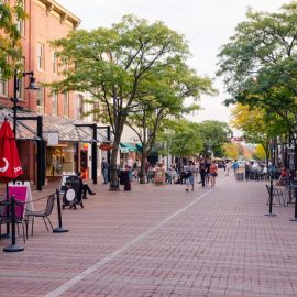 Church Street in Burlington, Vermont on a summer day - cobblestone pedestrian mall with businesses, customers and trees