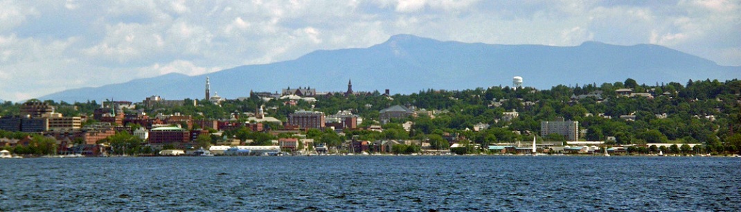 Viiew of Burlington, Vermont with buildings, mountains and water