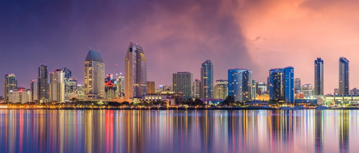 View of buildings in San Diego, California at night from the water