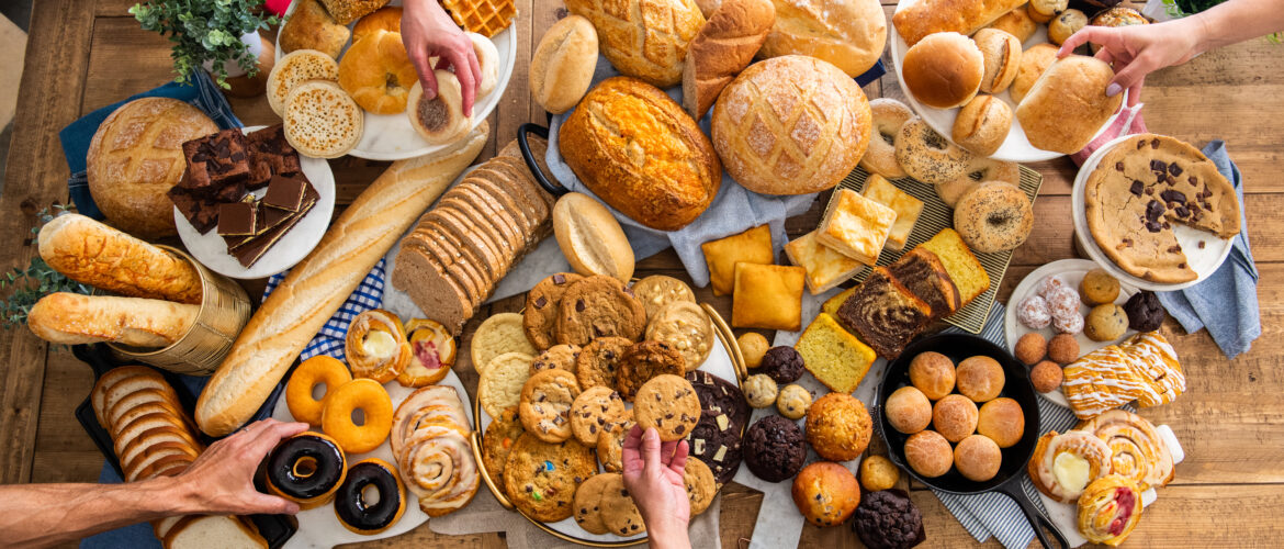 Table of food including breads and baked goods from Aspire Bakeries.